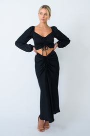 This is an image of Ziggy Skirt in Black - RESA featuring a model wearing the dress