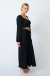 This is an image of Ziggy Skirt in Black - RESA featuring a model wearing the dress