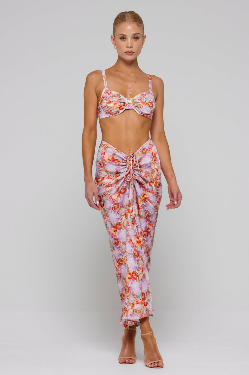 This is an image of Ziggy Skirt in Coral - RESA featuring a model wearing the dress