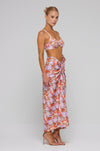 This is an image of Ziggy Skirt in Coral - RESA featuring a model wearing the dress
