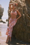 This is an image of Ziggy Skirt in Coral - RESA featuring a model wearing the dress
