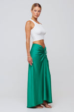 This is an image of Ziggy Skirt in Green - RESA featuring a model wearing the dress